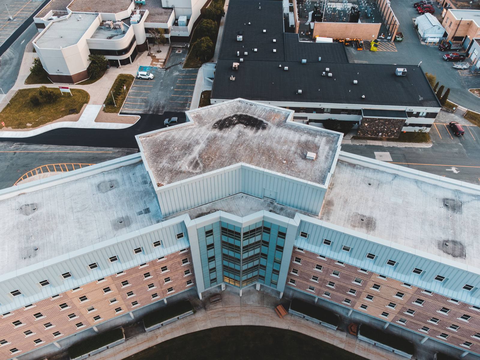 Aerial roof photo showing roof surfaces, penetrations, and surrounding context